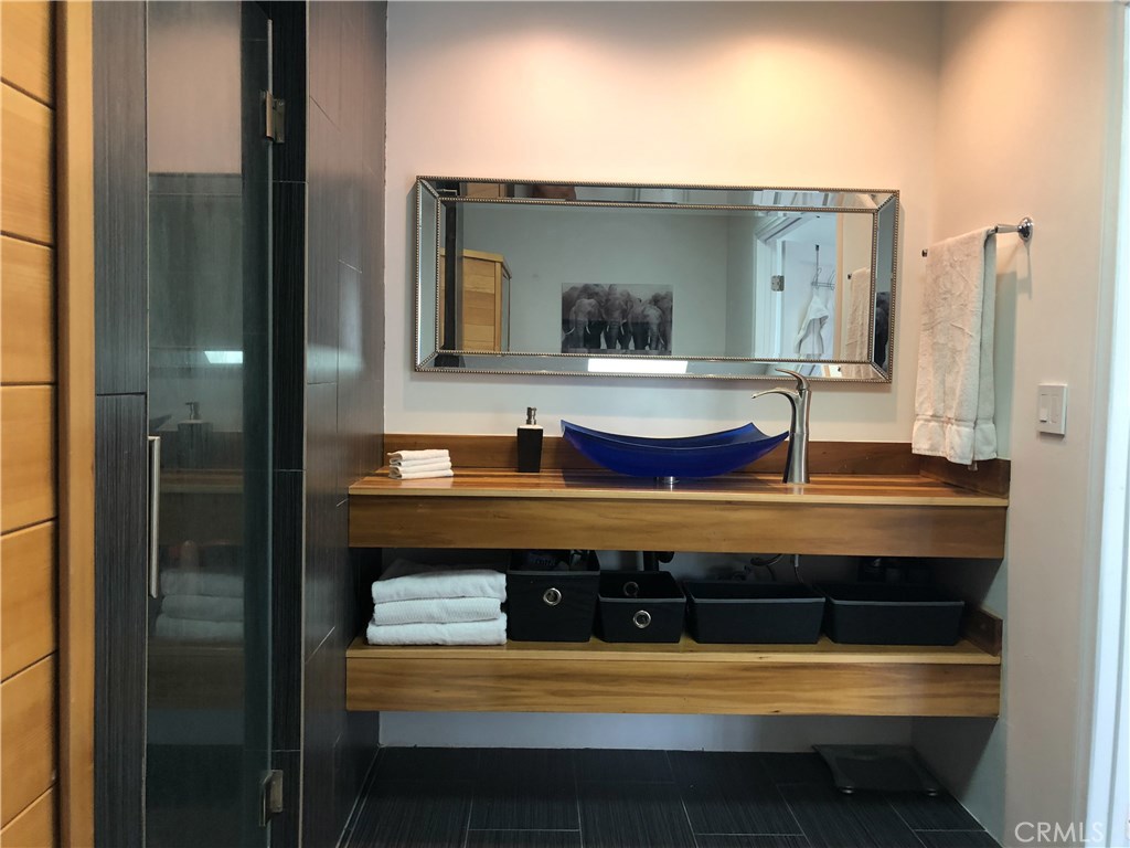 71292 Biskra Road Rancho Mirage, CA 92270 - Photo 15 of 27 a bathroom with a sink and a mirror