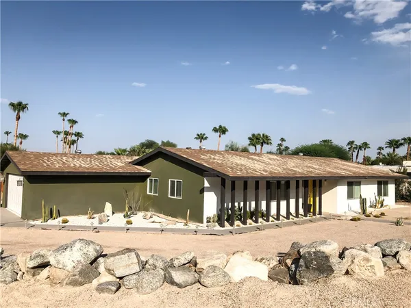 a view of a house with a outdoor space and window