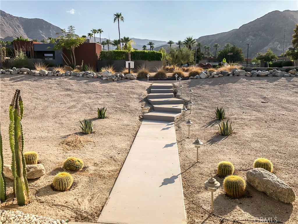 71292 Biskra Road Rancho Mirage, CA 92270 - Photo 27 of 27 a view of a terrace with furniture and a fireplace