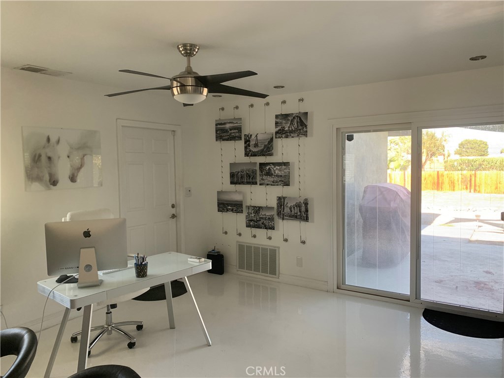 71292 Biskra Road Rancho Mirage, CA 92270 - Photo 3 of 27 a view of a workspace with furniture and a window