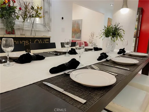 a table with chairs and a stove