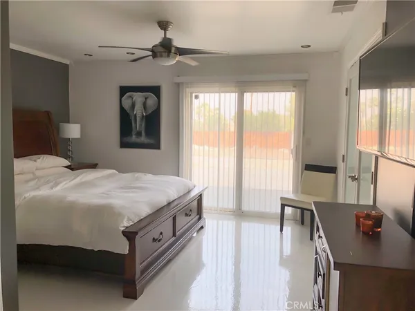 a bedroom with a bed and a desk