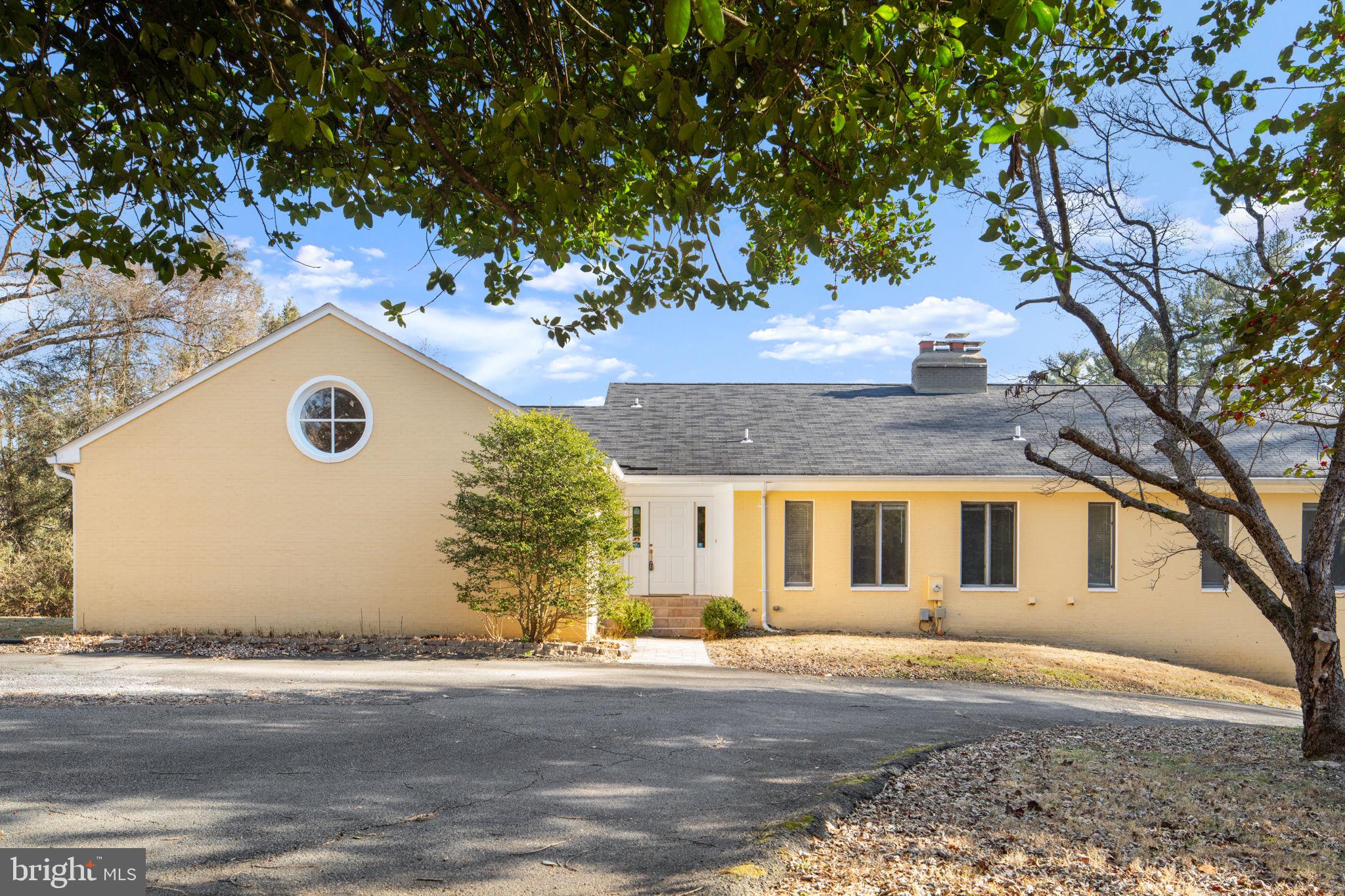 901 Walker Road Great Falls, VA 22066 - Photo 2 of 76 a view of a house with a tree