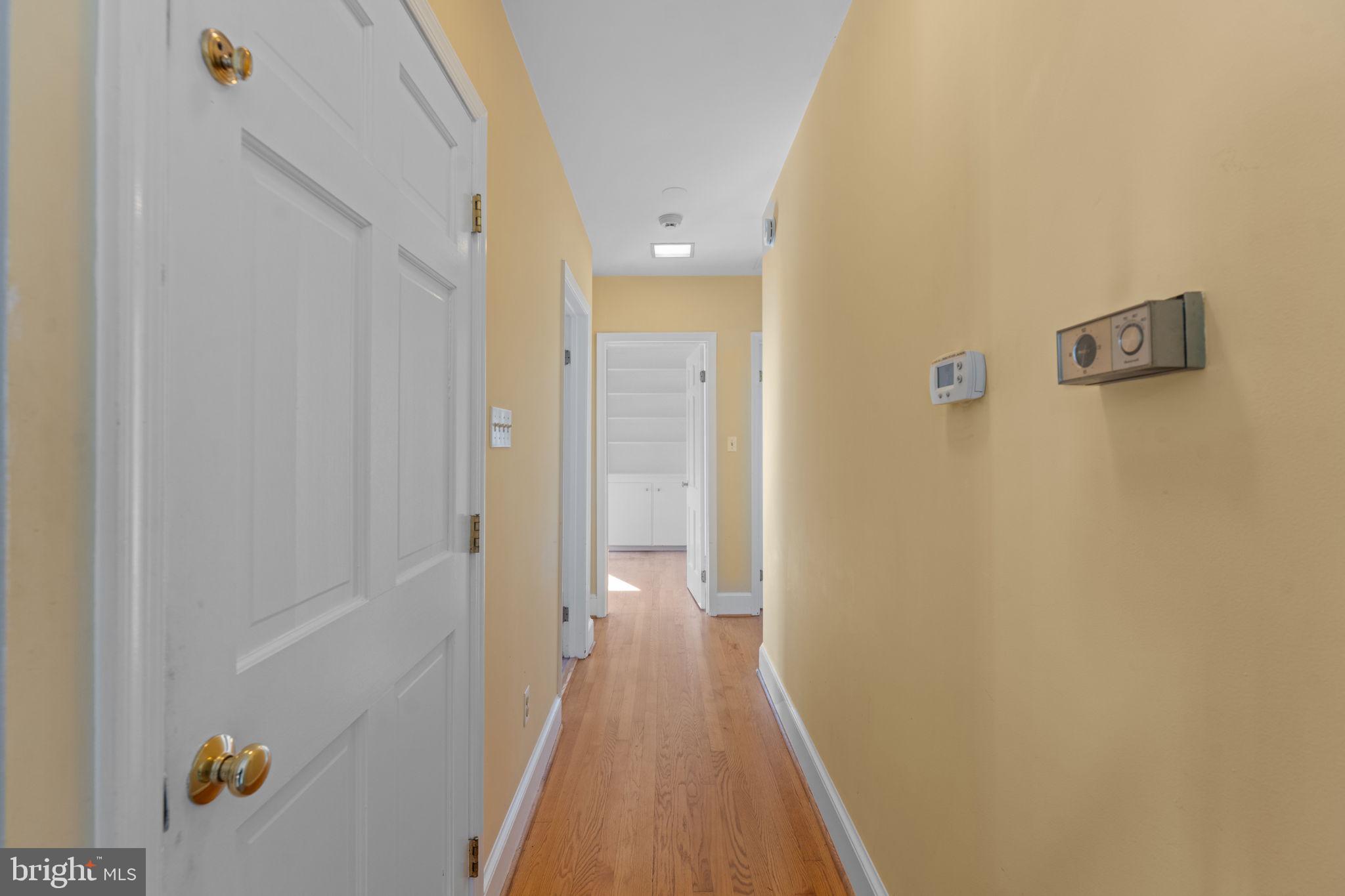 901 Walker Road Great Falls, VA 22066 - Photo 23 of 76 a view of a bathroom from the hallway
