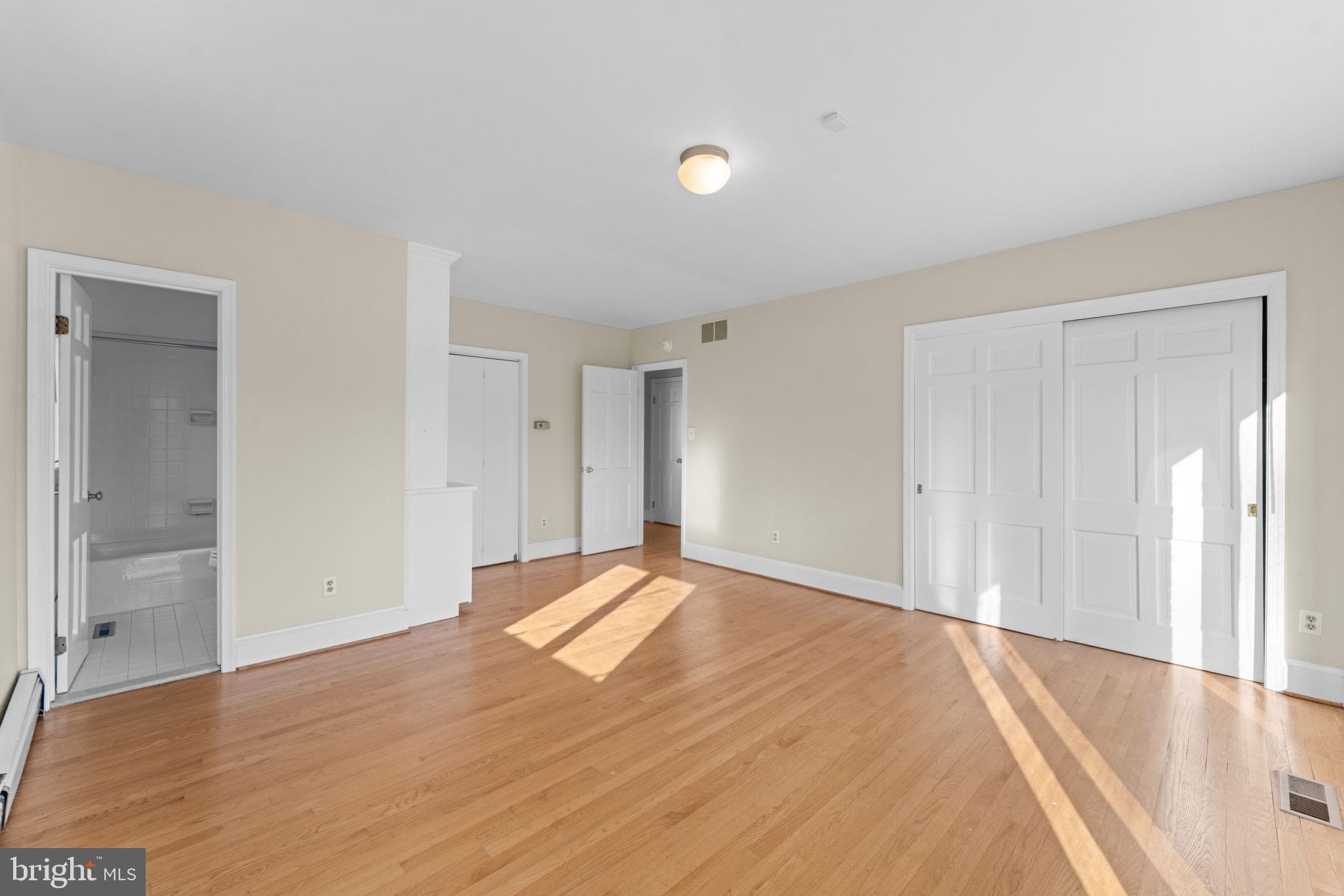 901 Walker Road Great Falls, VA 22066 - Photo 27 of 76 a view of empty room with wooden floor and fan