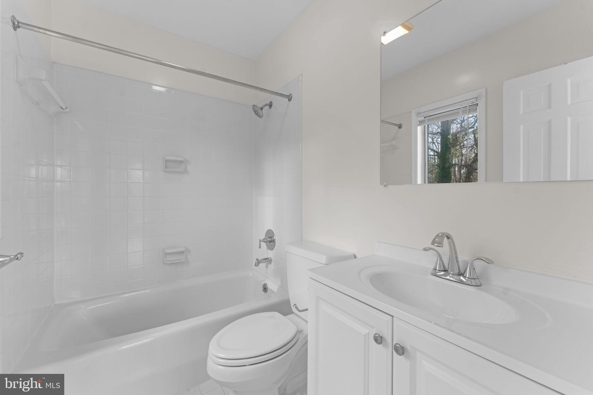 901 Walker Road Great Falls, VA 22066 - Photo 28 of 76 a bathroom with a sink toilet and shower