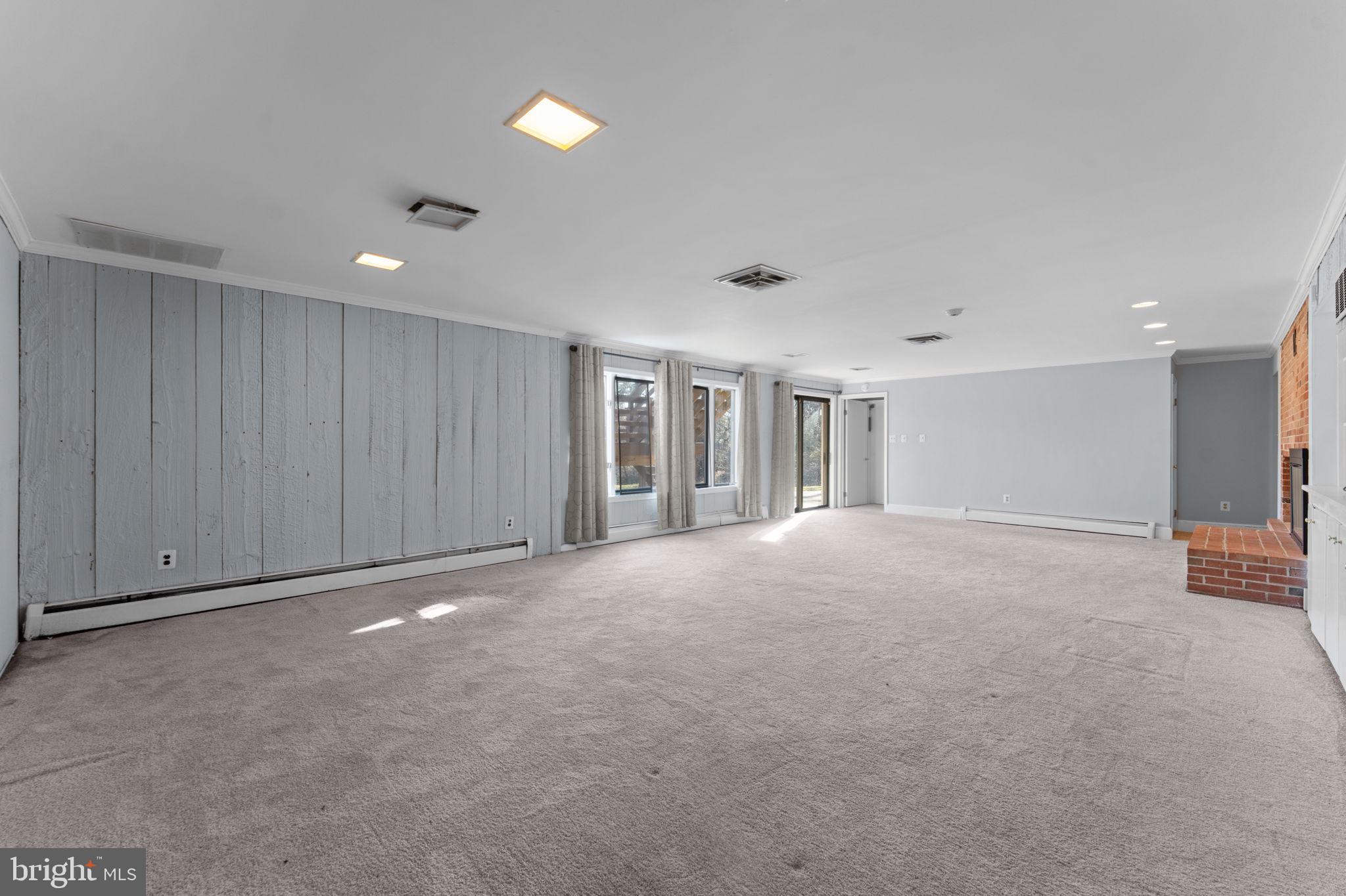 901 Walker Road Great Falls, VA 22066 - Photo 44 of 76 a view of an empty room with wooden floor