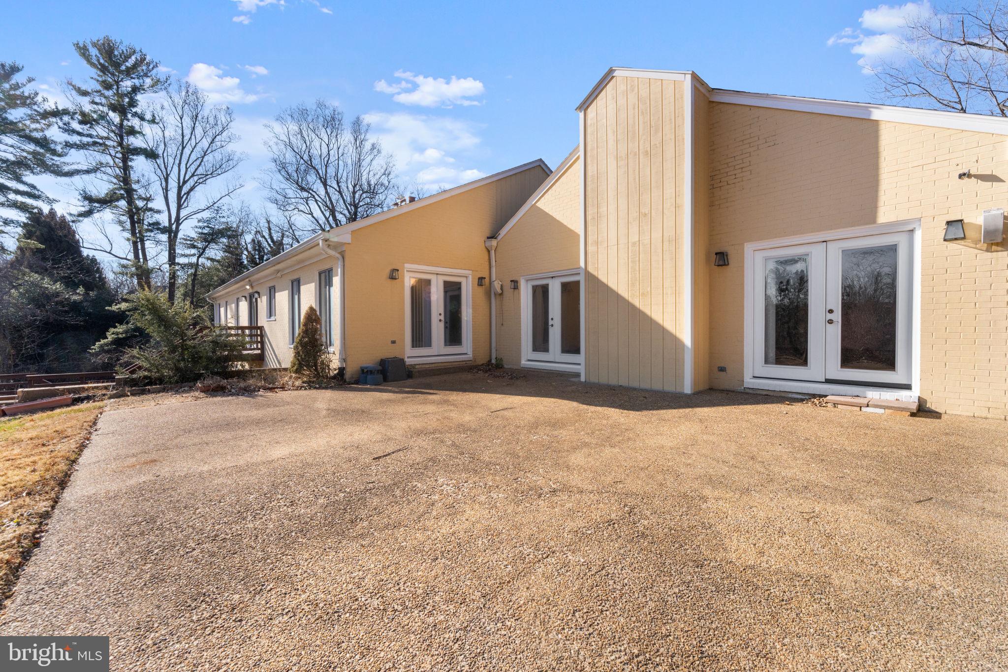 901 Walker Road Great Falls, VA 22066 - Photo 50 of 76 a view of a house with a snow in the yard
