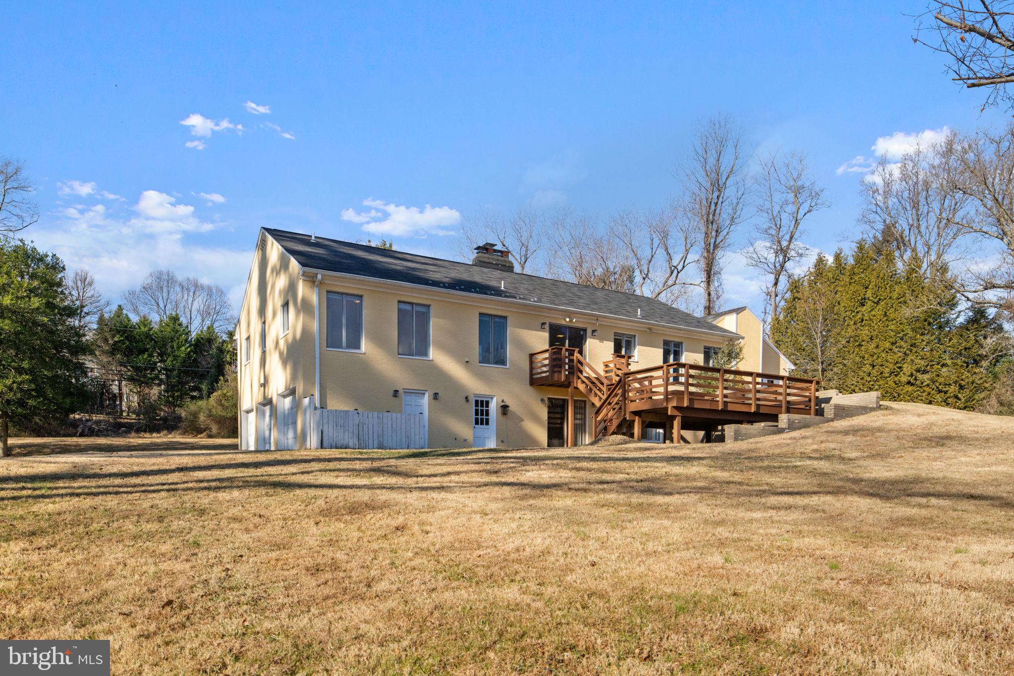 901 Walker Road Great Falls, VA 22066 - Photo 63 of 76 a front view of a house with a yard