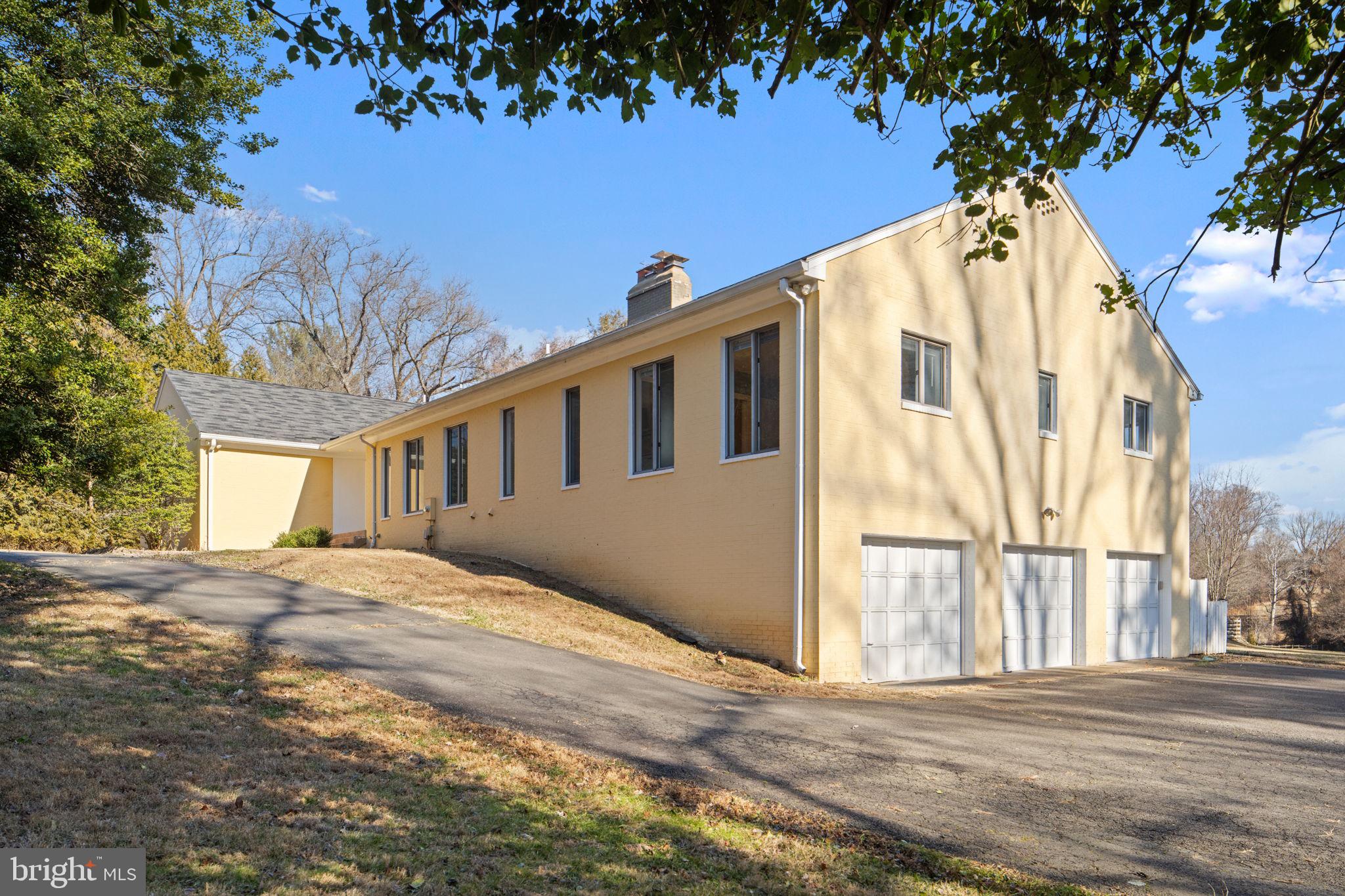 901 Walker Road Great Falls, VA 22066 - Photo 64 of 76 a view of a house with a yard