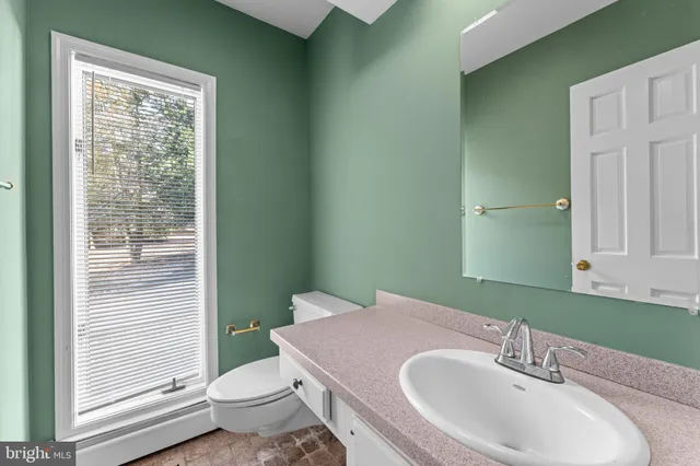 a kitchen with stainless steel appliances granite countertop a sink stove and microwave