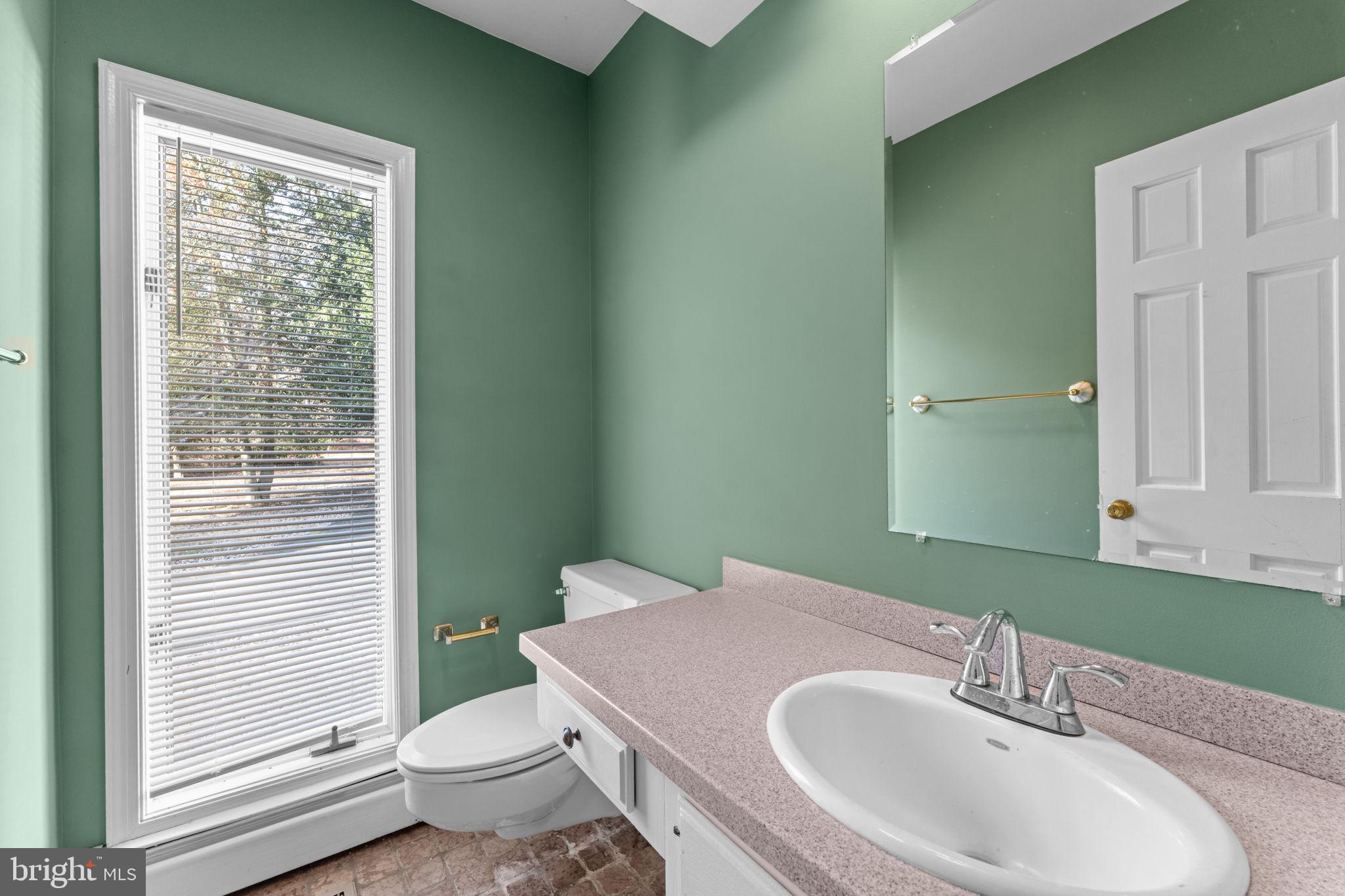 901 Walker Road Great Falls, VA 22066 - Photo 8 of 76 a bathroom with a sink and a toilet