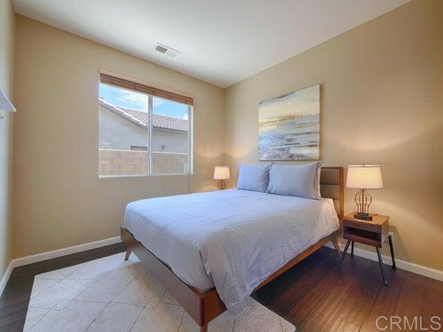 80596 Key Largo Avenue Indio, CA 92201 - Photo 22 of 59 a bedroom with a bed and a window