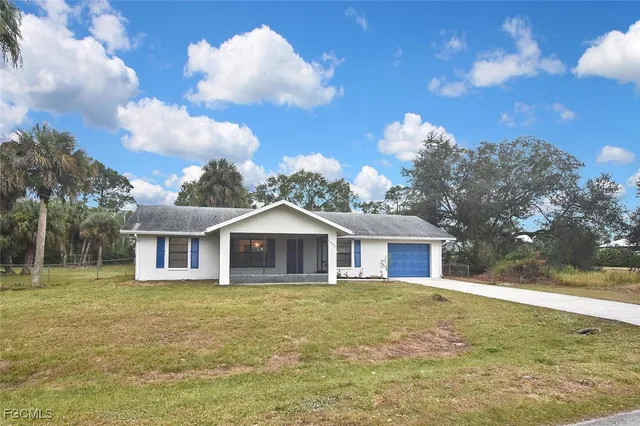a view of a house with a yard