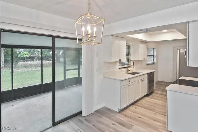 a kitchen with kitchen island wooden floor center island and appliances
