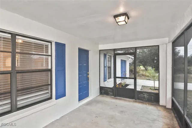 a view of a room with large windows