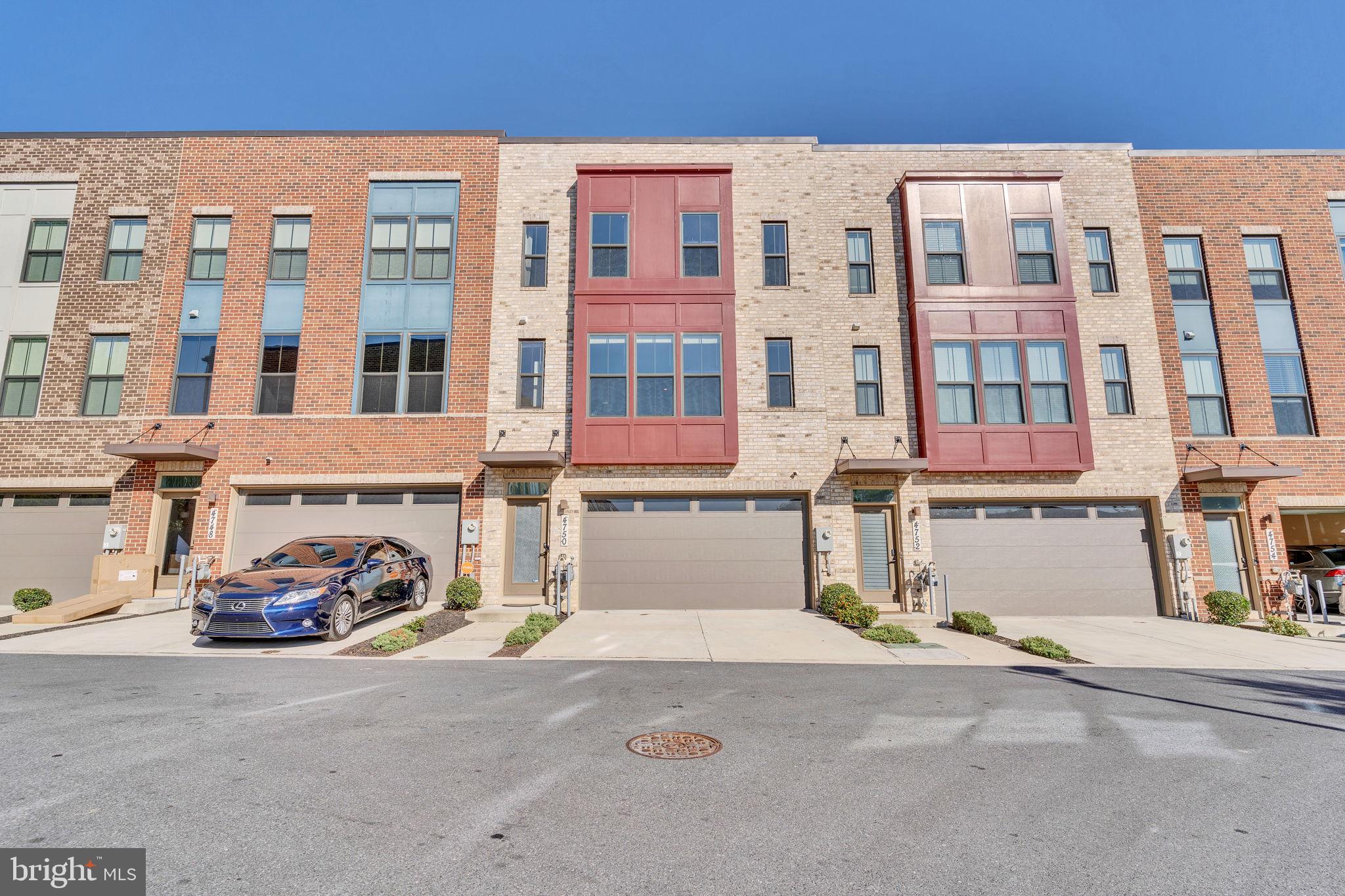 a couple of cars parked in front of a building