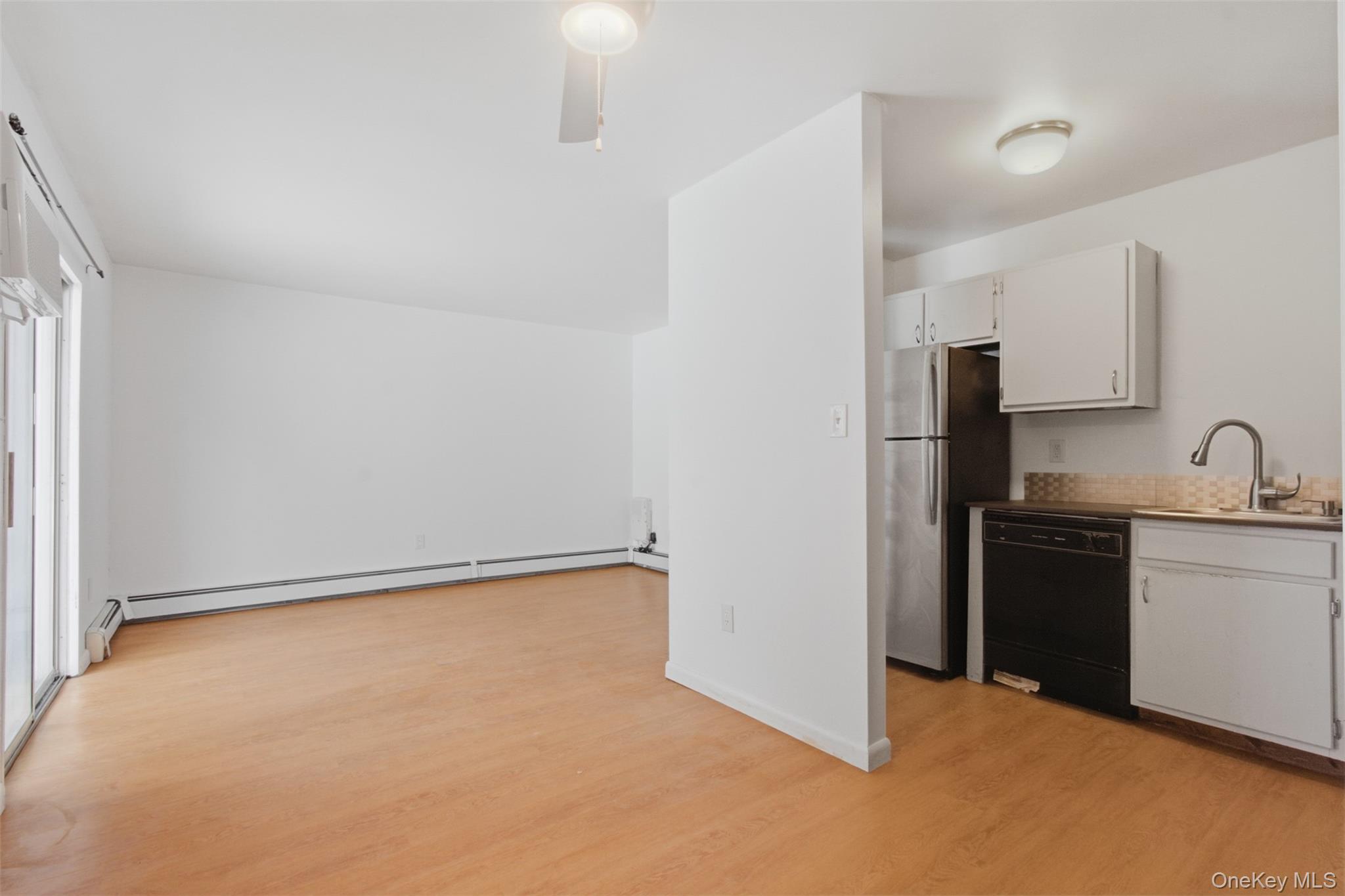 8 Ivy Court, Unit B Fishkill, NY 12524 - Photo 11 of 21 a kitchen with stainless steel appliances granite countertop a stove a sink and a refrigerator