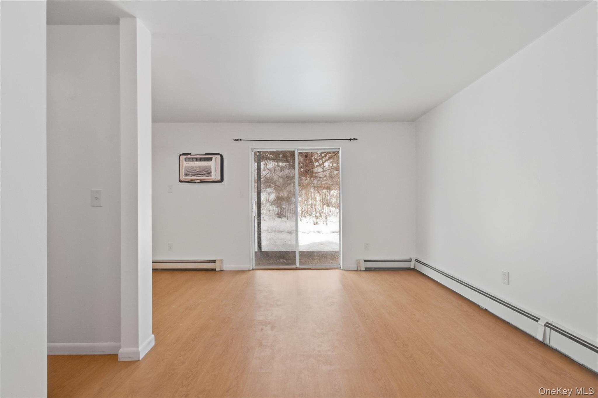 8 Ivy Court, Unit B Fishkill, NY 12524 - Photo 5 of 21 an empty room with windows