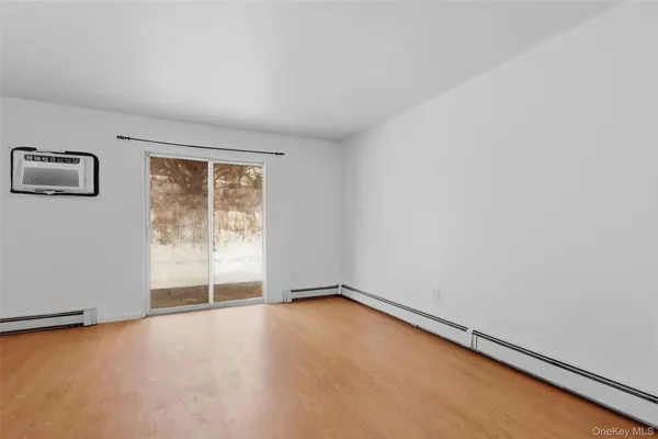an empty room with a empty space and window