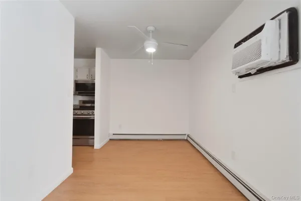 a view of an empty room with a bathroom