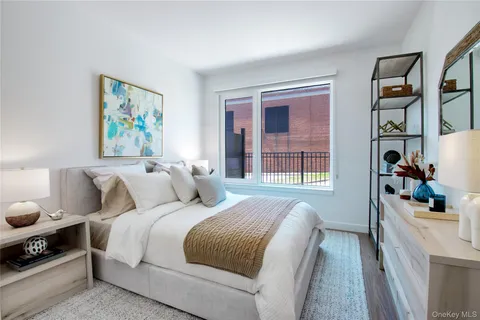 a bedroom with bed and a window