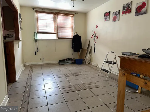 a room with gym equipment and a window