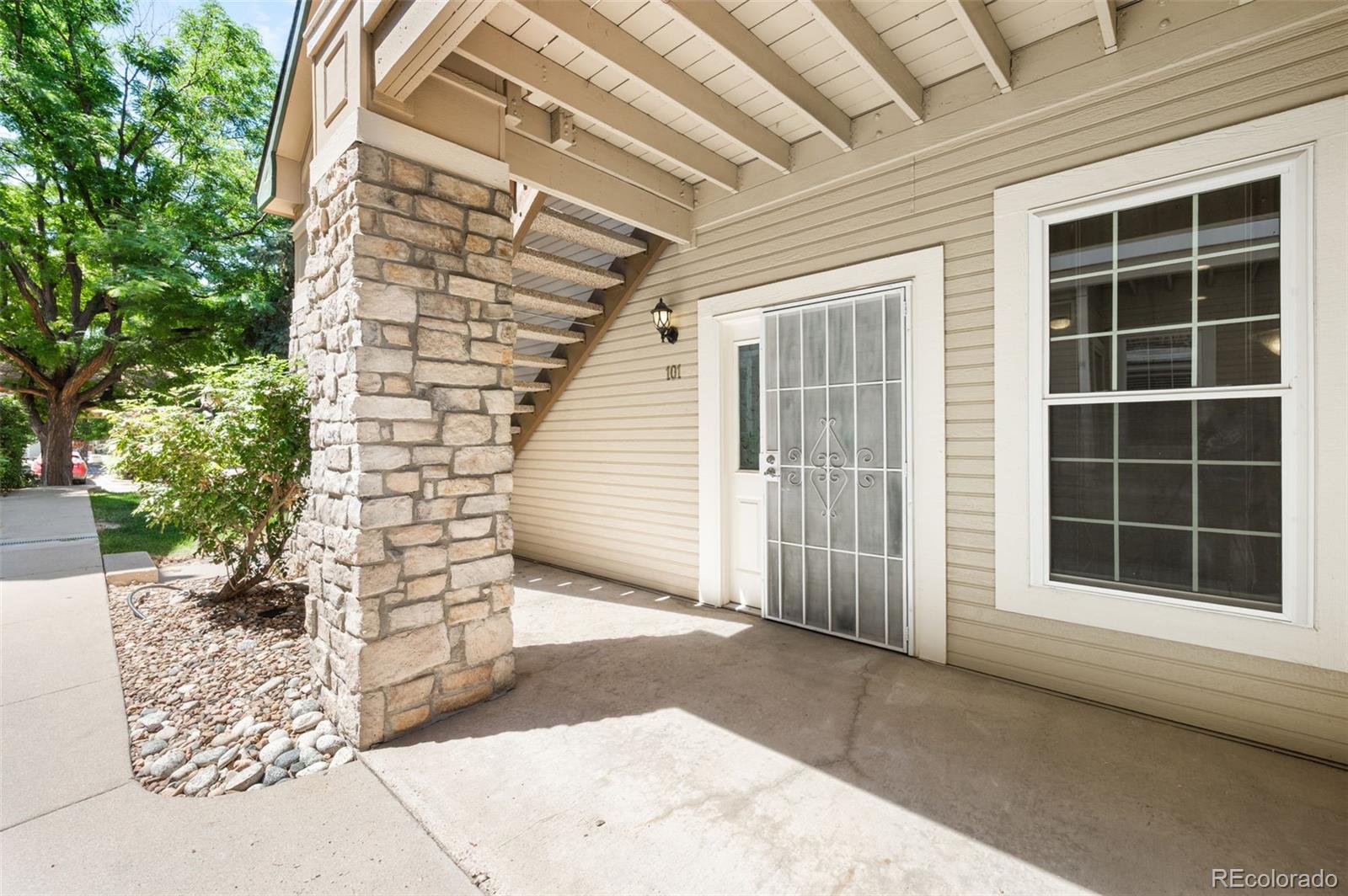 4064 South Carson Street, Unit 101 Aurora, CO 80014 - Photo 18 of 19 a view of front door with outdoor space