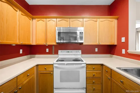 a kitchen with a sink and a window