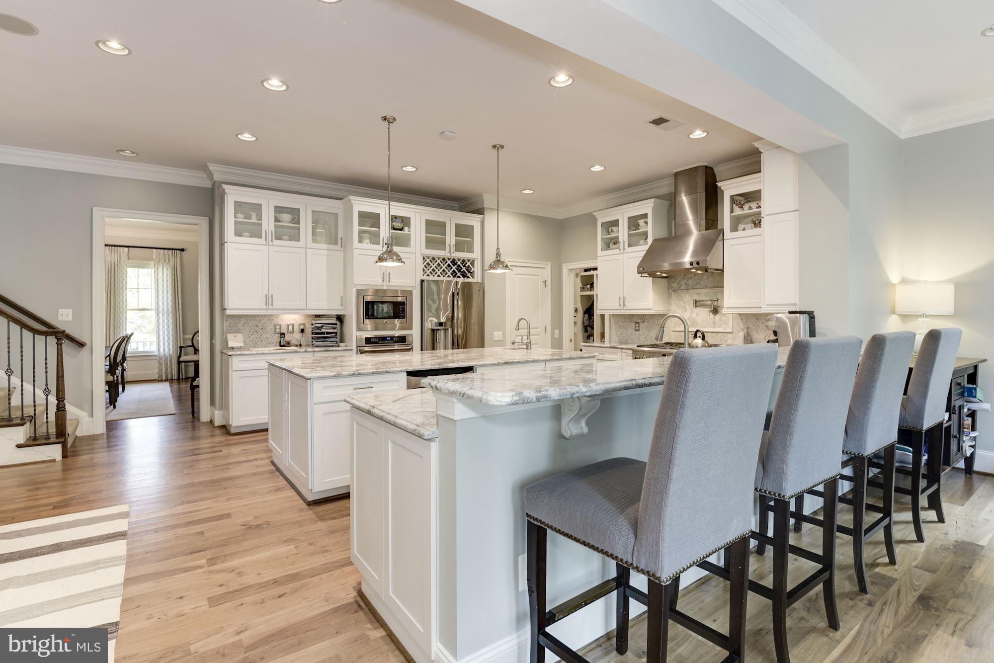 11645 Pine Tree Drive Fairfax, VA 22033 - Photo 12 of 48 a large kitchen with a table and chairs