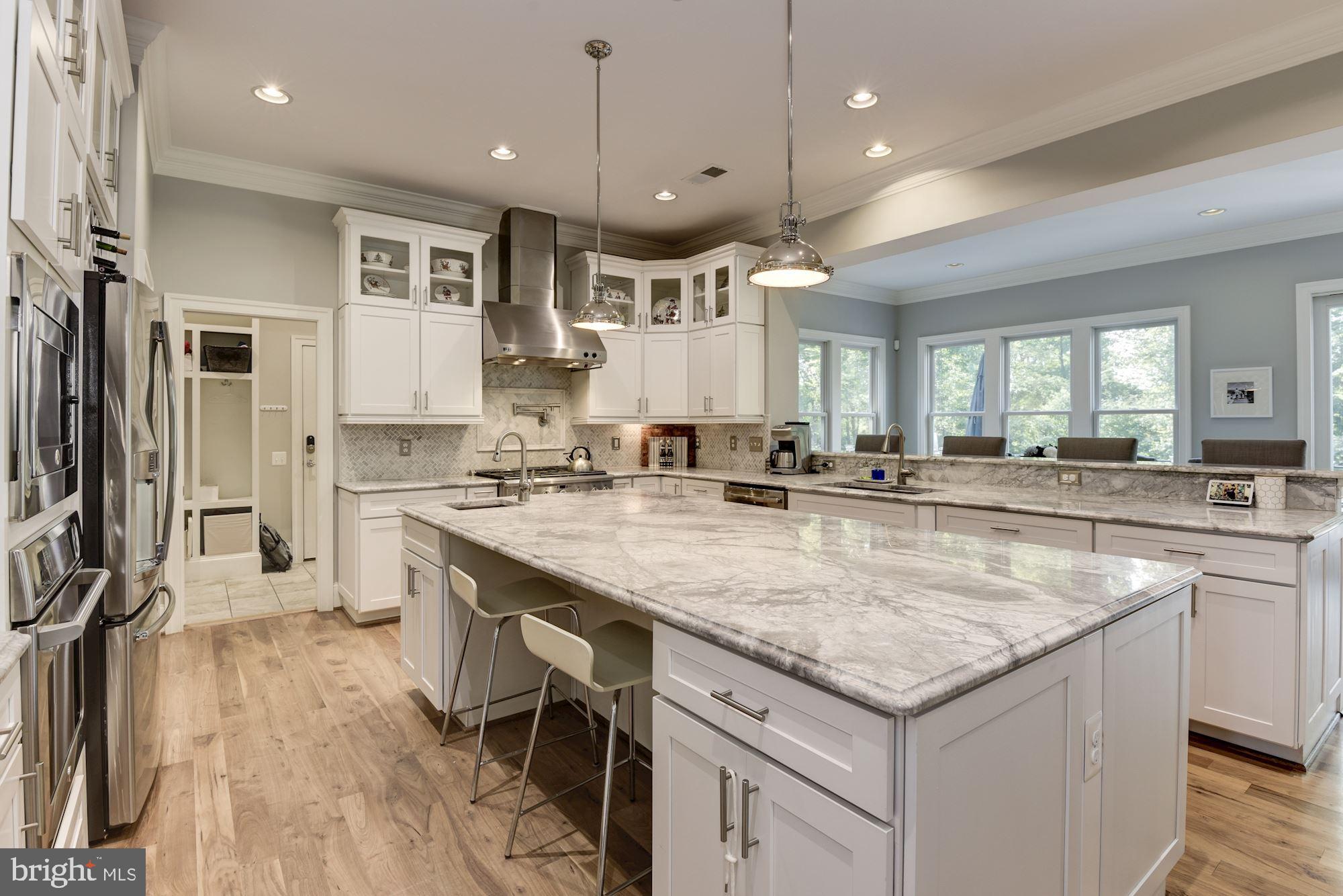 11645 Pine Tree Drive Fairfax, VA 22033 - Photo 14 of 48 a kitchen with stainless steel appliances granite countertop a stove and a sink