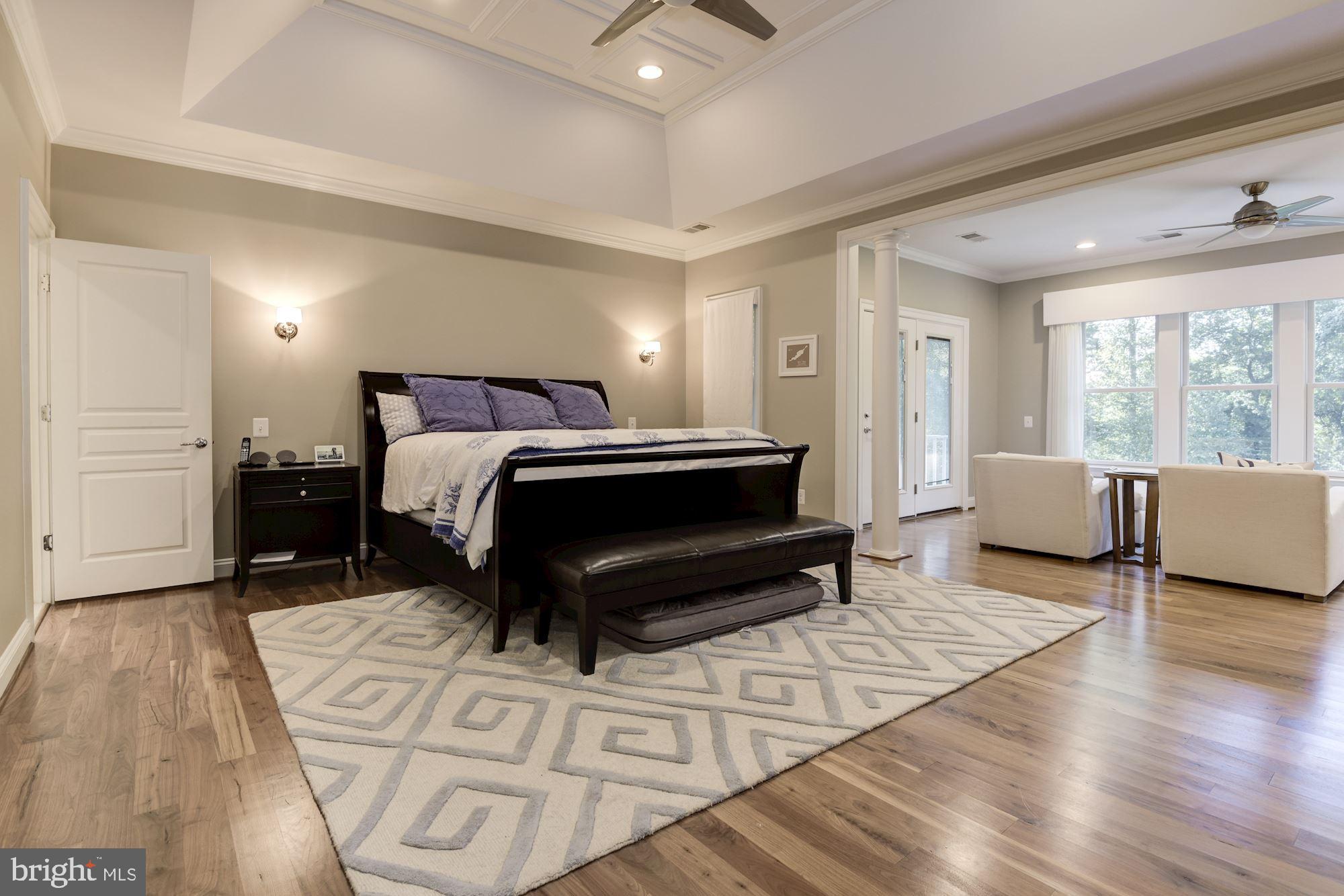 11645 Pine Tree Drive Fairfax, VA 22033 - Photo 16 of 48 a spacious bedroom with a bed a couch and large window