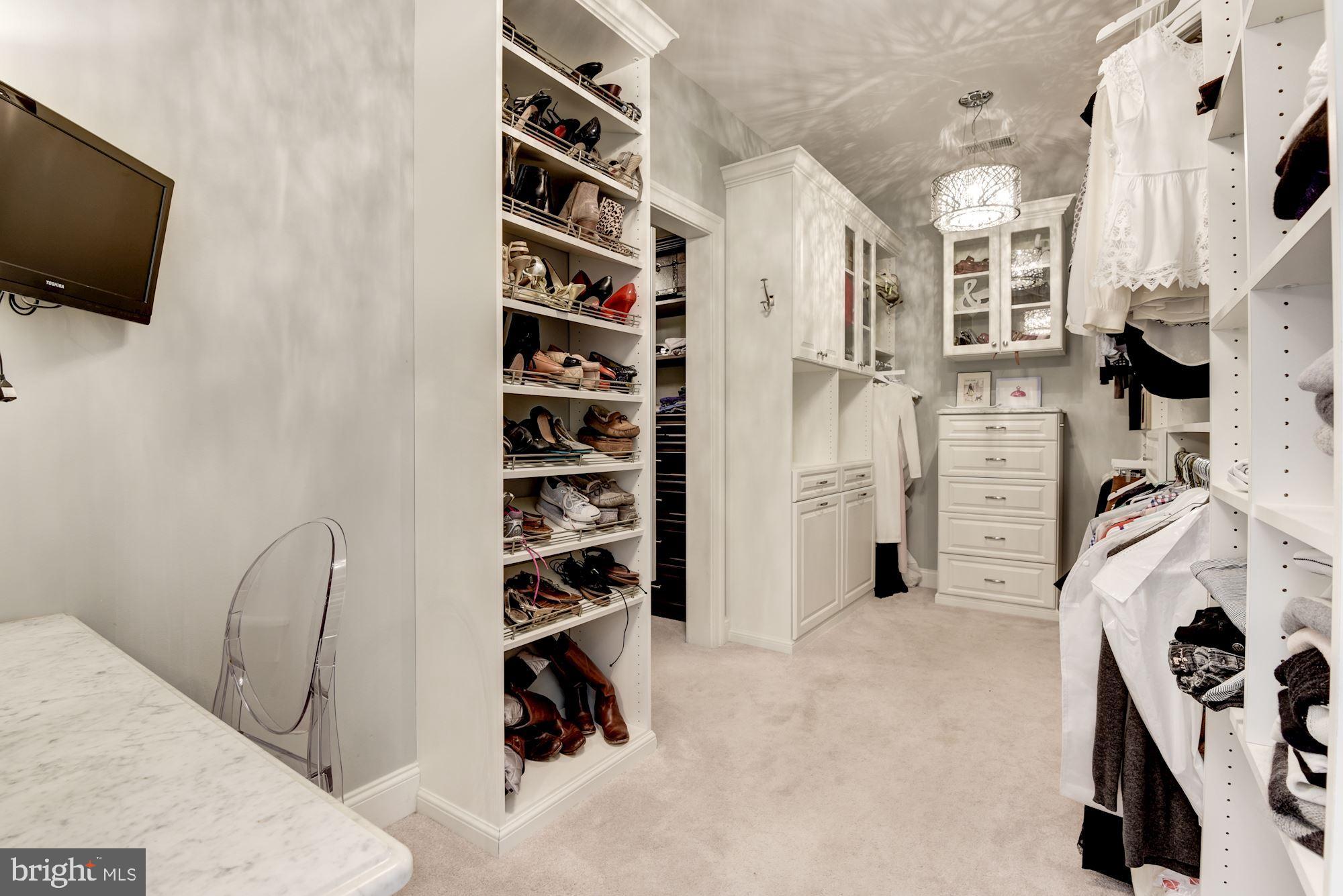 11645 Pine Tree Drive Fairfax, VA 22033 - Photo 22 of 48 walk in closet with flat screen tv and gym equipment