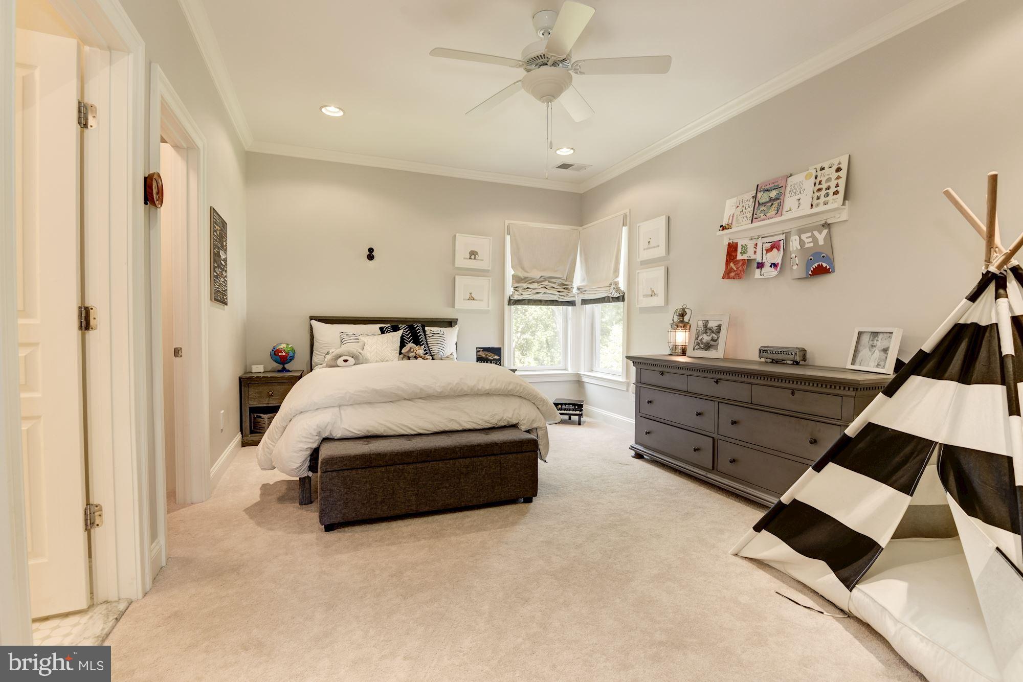 11645 Pine Tree Drive Fairfax, VA 22033 - Photo 25 of 48 a bedroom with a bed and a chandelier