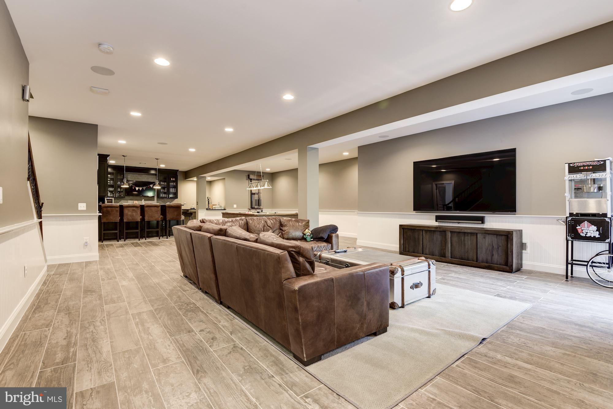 11645 Pine Tree Drive Fairfax, VA 22033 - Photo 30 of 48 a living room with furniture and a flat screen tv
