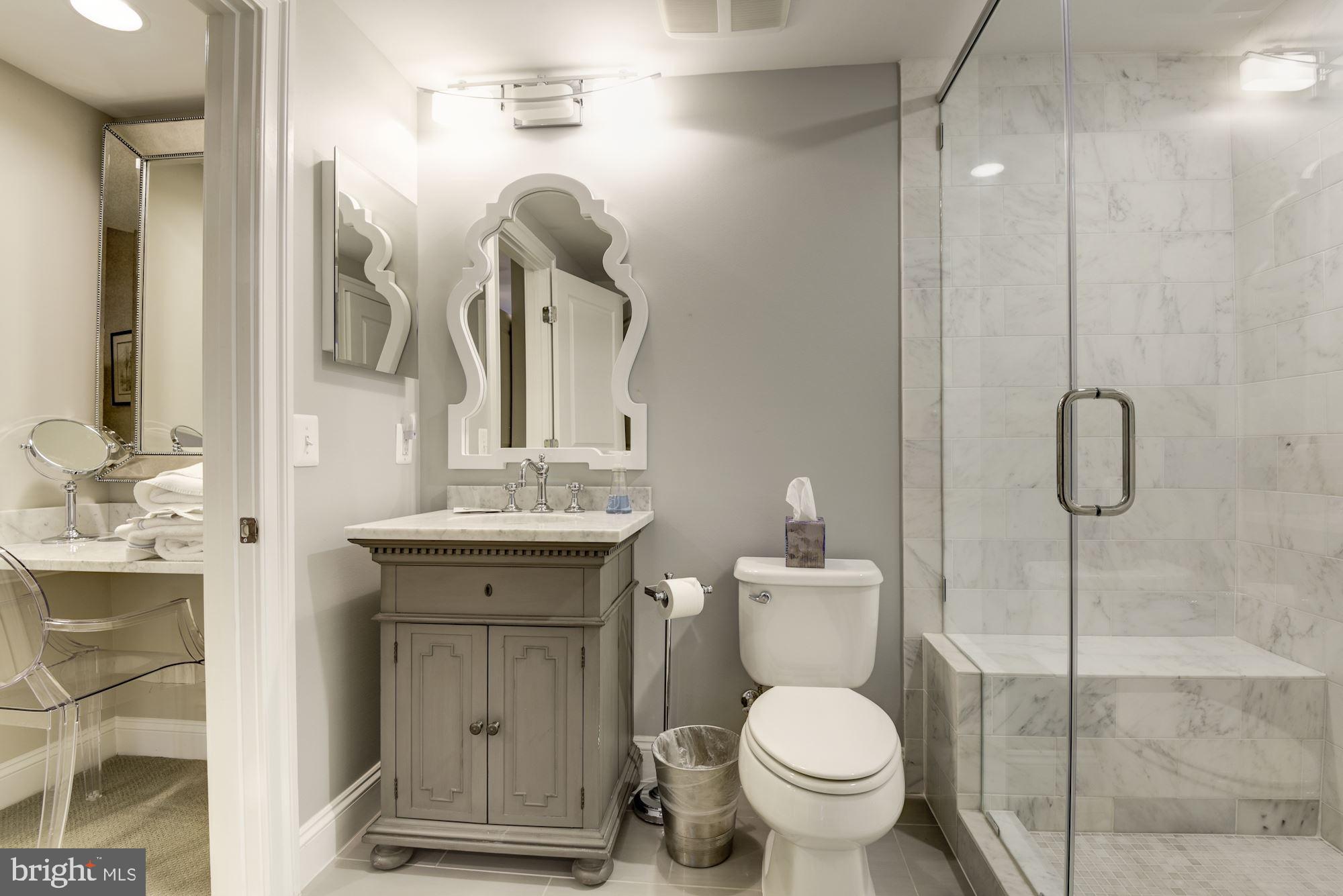 11645 Pine Tree Drive Fairfax, VA 22033 - Photo 35 of 48 a bathroom with a granite countertop toilet sink and mirror