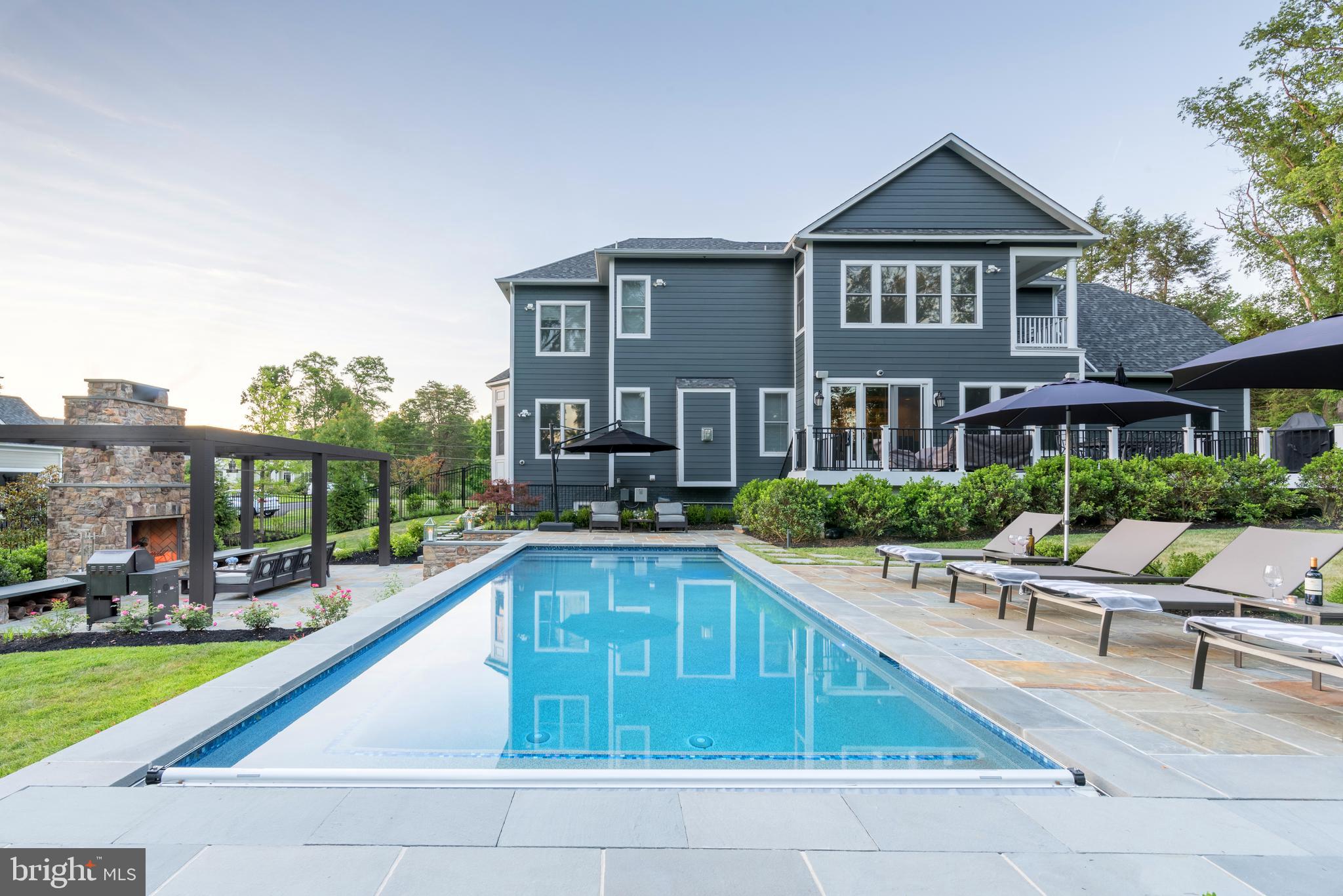 11645 Pine Tree Drive Fairfax, VA 22033 - Photo 40 of 48 a swimming pool view with a seating space and a garden view
