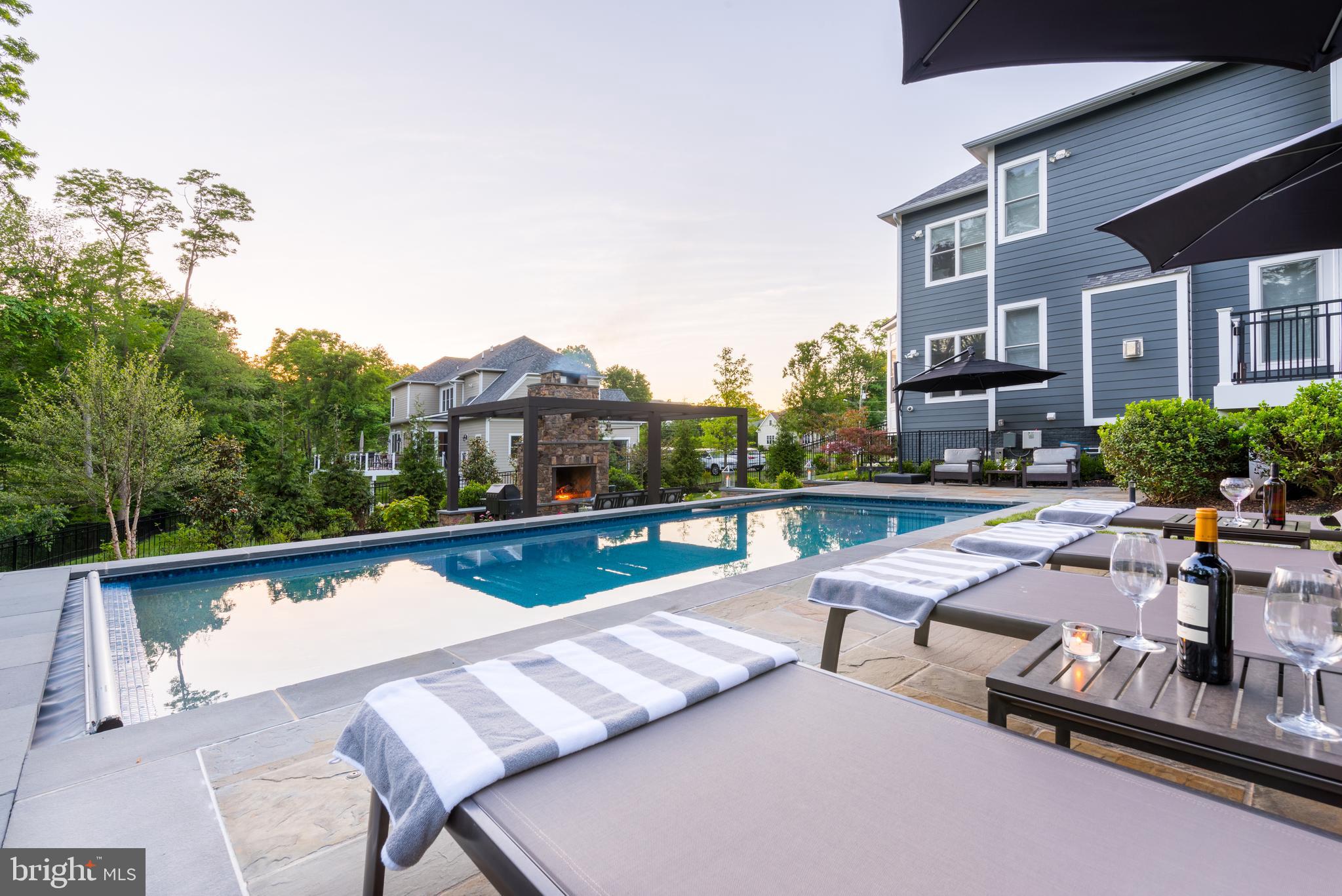11645 Pine Tree Drive Fairfax, VA 22033 - Photo 41 of 48 a view of swimming pool with outdoor seating and a potted plants