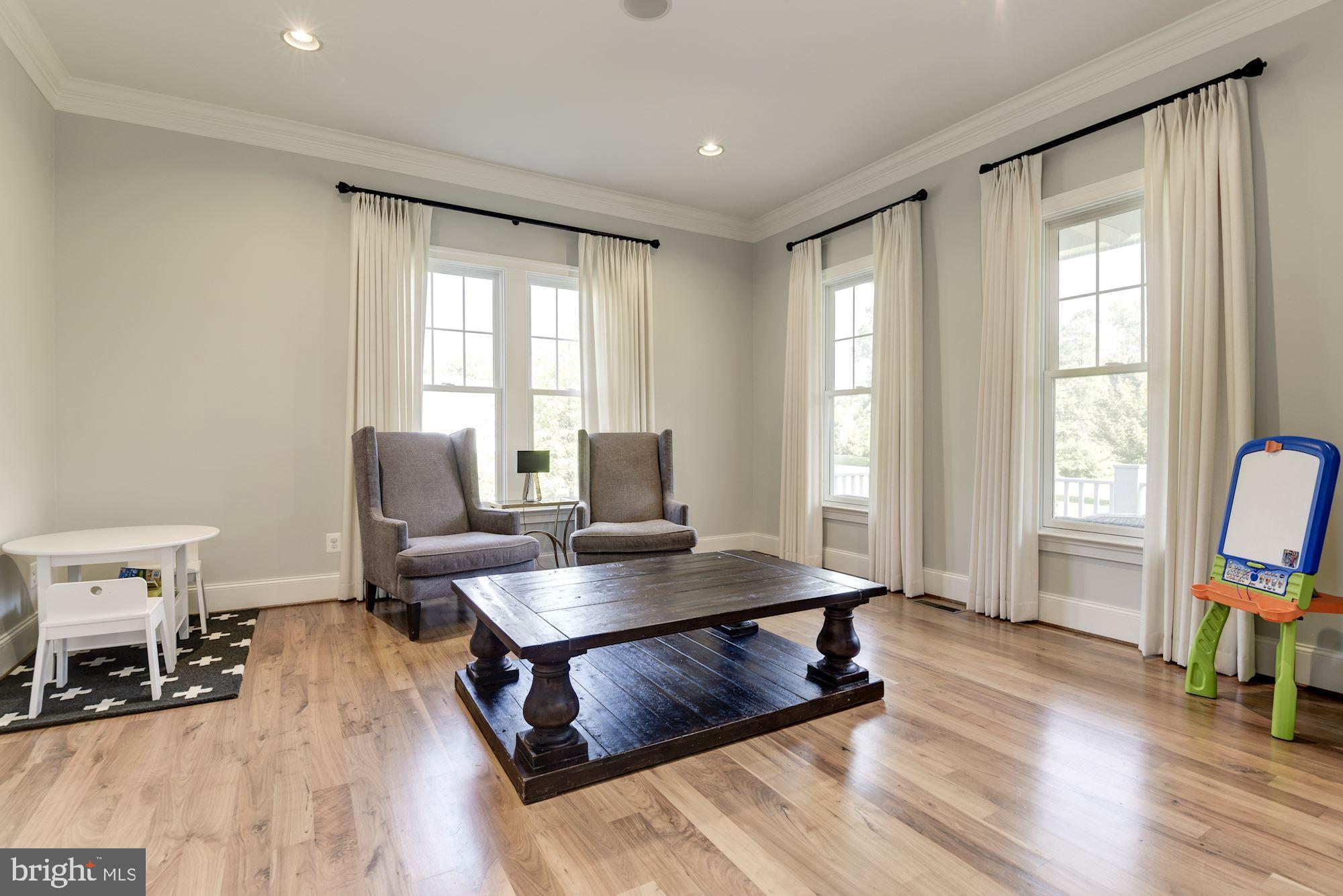 11645 Pine Tree Drive Fairfax, VA 22033 - Photo 6 of 48 a workspace with furniture hardwood and a window