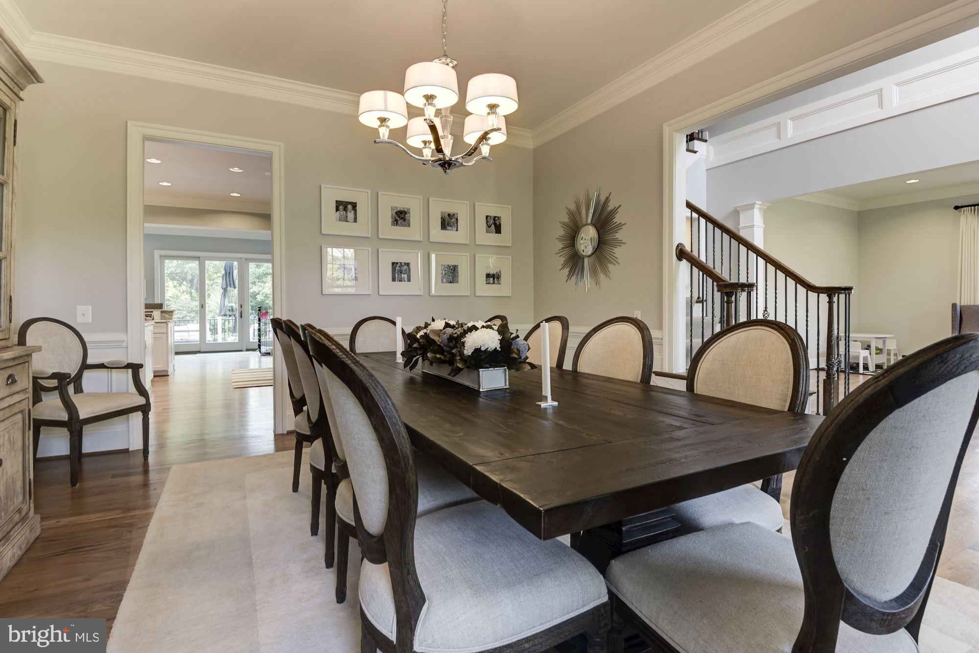 11645 Pine Tree Drive Fairfax, VA 22033 - Photo 7 of 48 a view of a dining room with furniture a chandelier and wooden floor