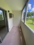 105 Mansfield F, Unit C Boca Raton, FL 33434 - Photo 14 of 14 a view of a hallway with a outdoor space