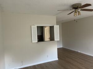 105 Mansfield F, Unit C Boca Raton, FL 33434 - Photo 3 of 14 a view of an empty room with a window