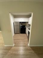 105 Mansfield F, Unit C Boca Raton, FL 33434 - Photo 5 of 14 a view of empty room and wooden floor