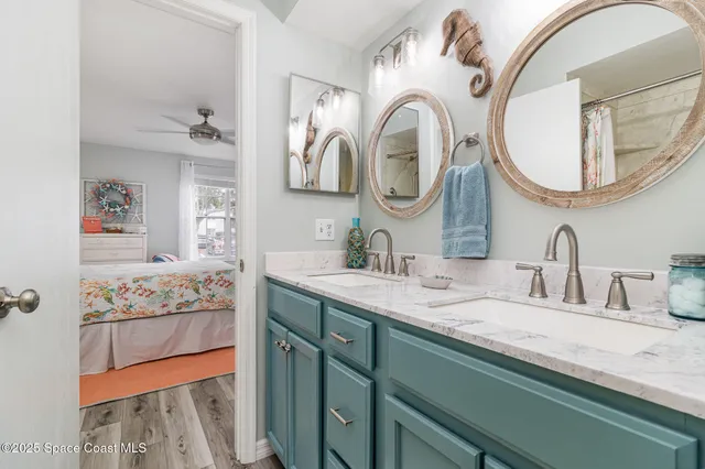 a front view of a house with outdoor seating and a potted plant