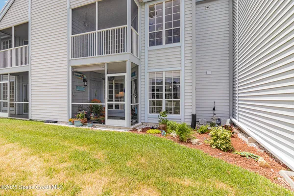 an aerial view of a house with a lake view