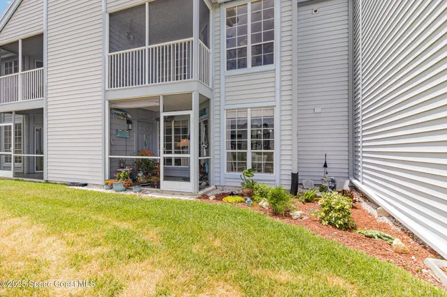 an aerial view of a house with a lake view