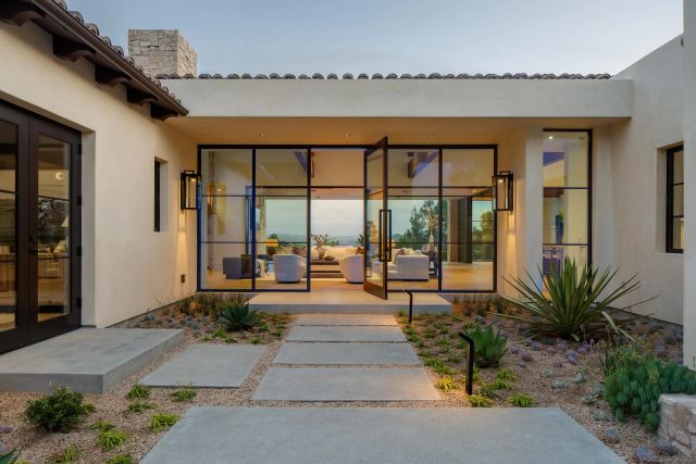 a lobby with furniture and floor to ceiling window