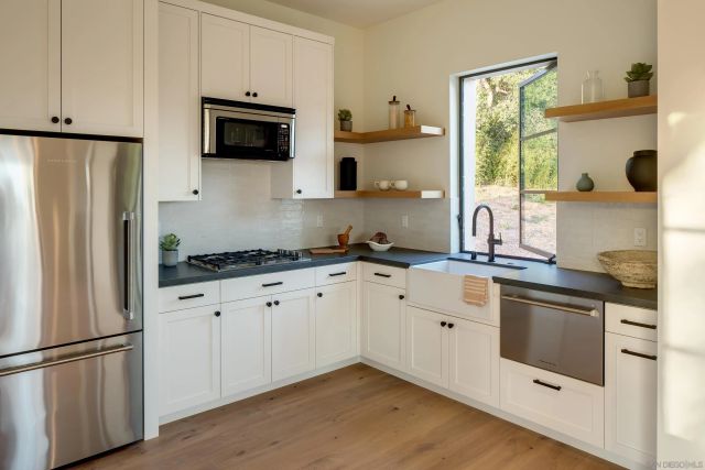 a bathroom with 2 sink and a mirror