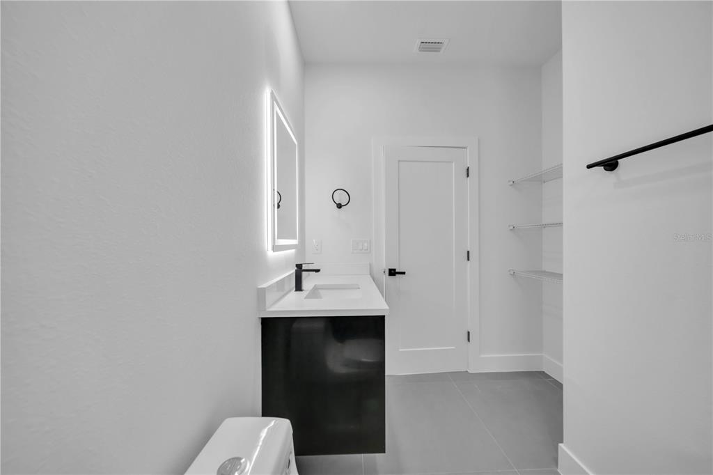 2328 Irondale Road North Port, FL 34287 - Photo 34 of 45 a bathroom with a sink and toilet
