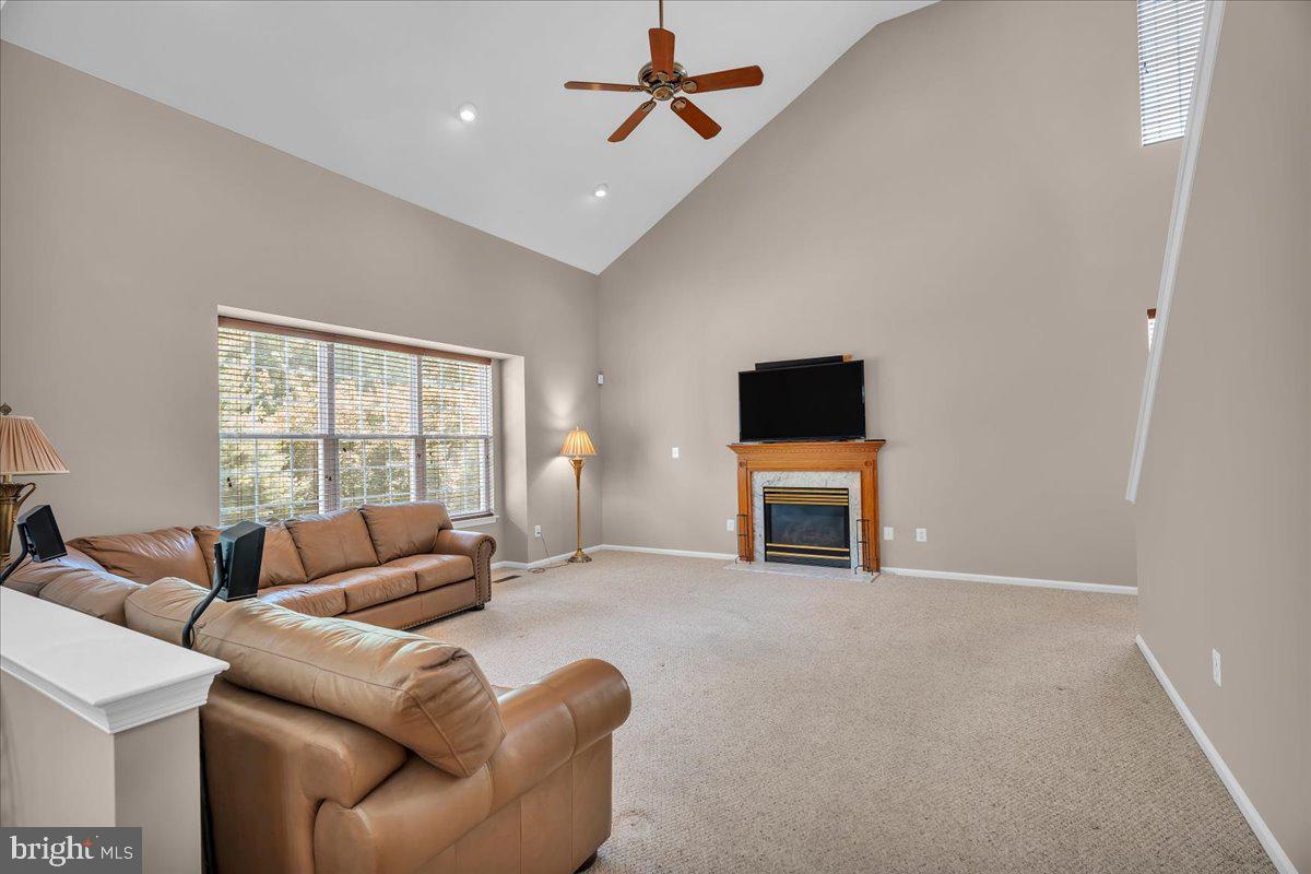 68 Hillside Lane Mount Laurel, NJ 08054 - Photo 14 of 36 a living room with furniture a fireplace and a flat screen tv